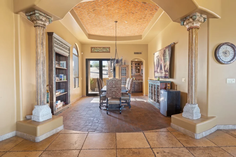 Formal dining room framed by classical columns
