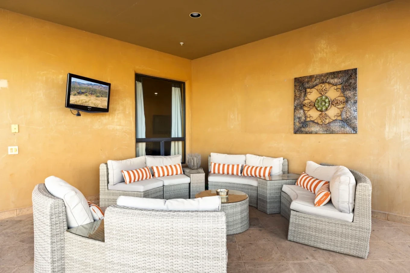 Bright sitting room with white wicker sectional seating