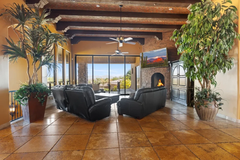 Living area with fireplace, leather recliners and mountain views